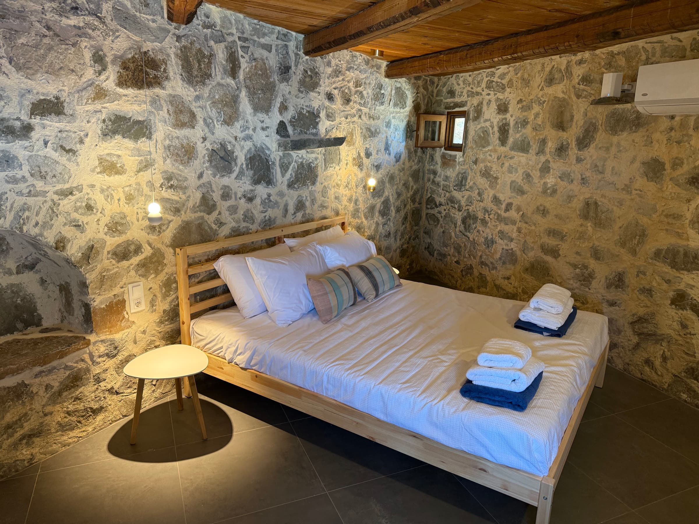 Jasmine suite under the timber ceiling and stone walls