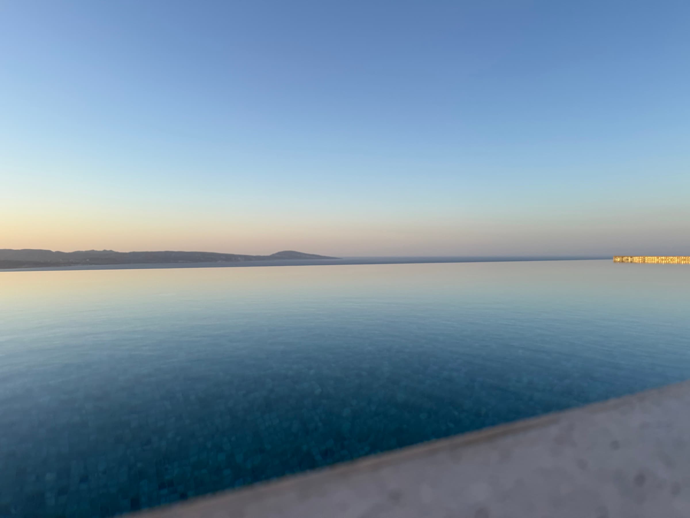 The infinity edge at twilight, sea and sky merging